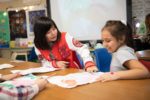 two girls have fun in art class, copyright by ipaintmymind
