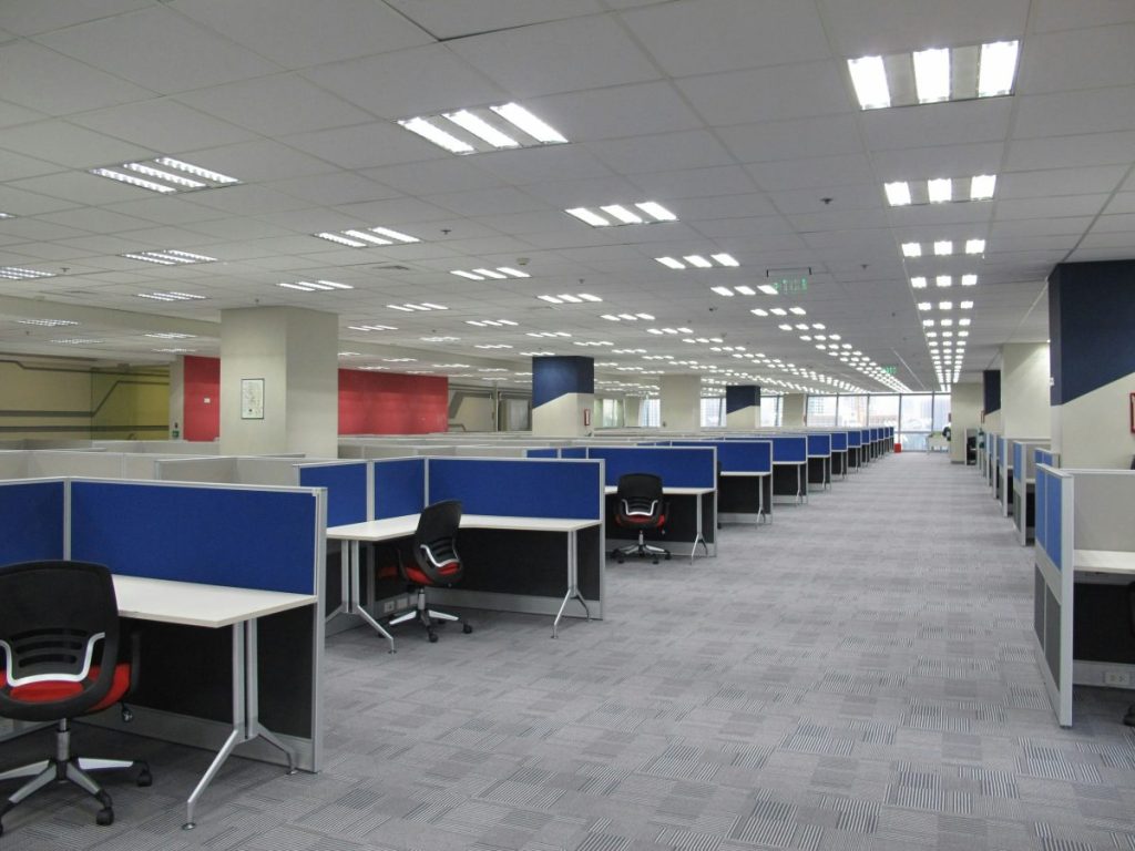 boring office space, a drab office with cubicles. This office demonstrated the need for inspiring workplace design.